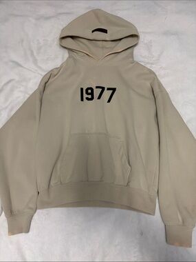 Essentials Men's Hoodie in Beige with Black '1977' Printing